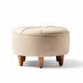 Round upholstered ottoman with a beige fabric cover and wooden legs 70 x 70 x 40cm
